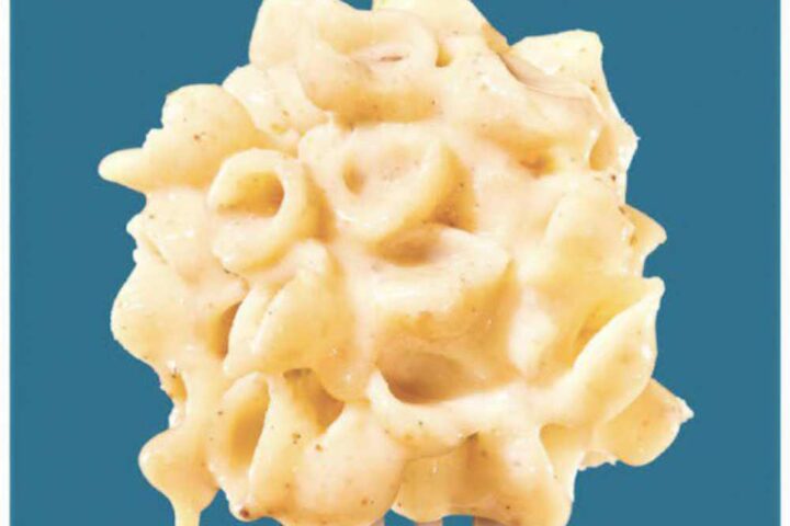 Goodles "Vegan Is Believin'" mac and cheese package showing plant-based white cheddar with spirals, subject to FDA recall for undeclared milk allergens.
