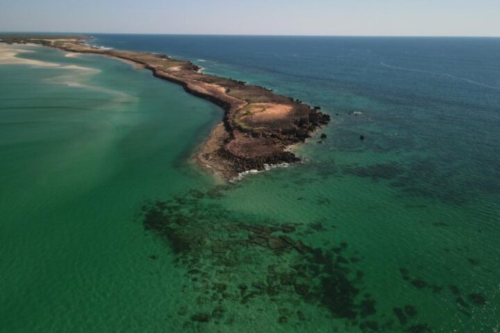 Aerial view of Kimberley coastline with sandy beaches, rocky headlands, and turquoise waters within the Bardi Jawi Gaarra Marine Park in Western Australia.