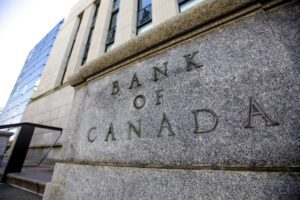 Bank of Canada building facade showing carved stone text on grey granite exterior in Ottawa