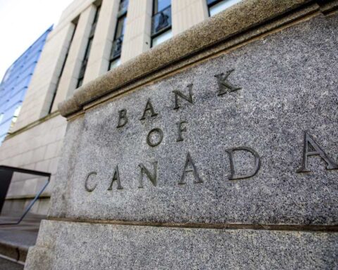 Bank of Canada building facade showing carved stone text on grey granite exterior in Ottawa