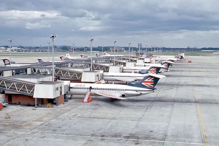 A line of British European Airways Hawker Siddeley Trident jetliners on the tarmac at London Heathrow Airport's Terminal 1 in 1971.