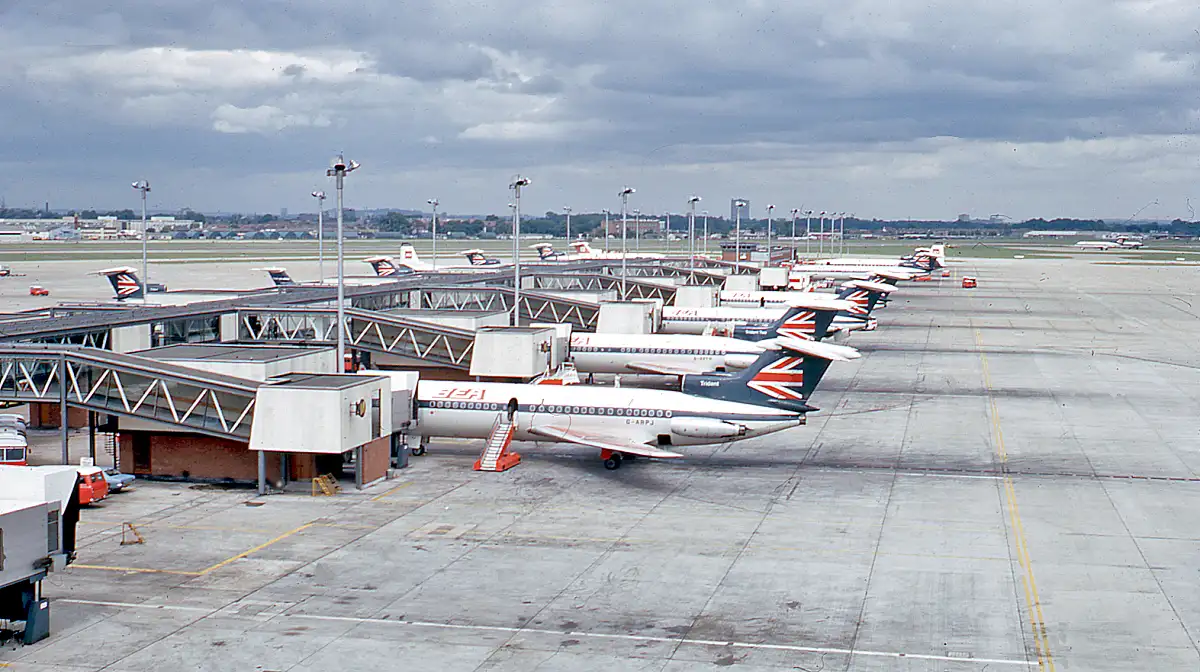 A line of British European Airways Hawker Siddeley Trident jetliners on the tarmac at London Heathrow Airport's Terminal 1 in 1971.