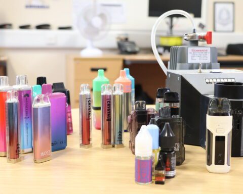 A pile of colorful, confiscated vape pens collected from secondary schools in England, many of which were found to contain dangerous synthetic cannabinoids.