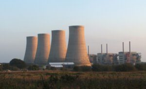 Chapelcross Nuclear Power Station in Scotland with its four distinctive cooling towers against a cloudy sky