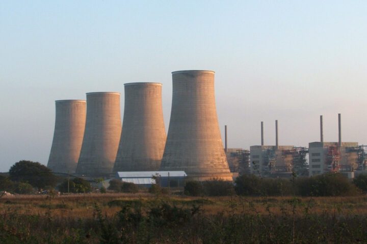 Chapelcross Nuclear Power Station in Scotland with its four distinctive cooling towers against a cloudy sky
