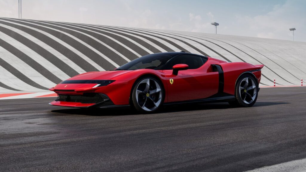 Side view of red Ferrari 849 Testarossa showing aerodynamic profile and large side air intakes
