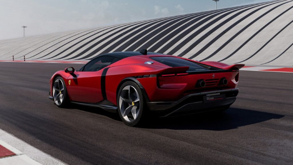 Rear three-quarter view of Ferrari 849 Testarossa showing twin-tail design, diffuser, and exhaust system