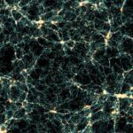 Visualization of the cosmic web from the Flagship 2 simulation showing the network-like structure of dark matter and galaxy distribution throughout the universe, with bright yellow-white nodes connected by thin filaments against a black background.