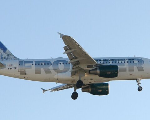 Frontier Airlines Airbus A319 aircraft with its distinctive animal livery featuring a bird on the tail fin approaching landing with landing gear down.