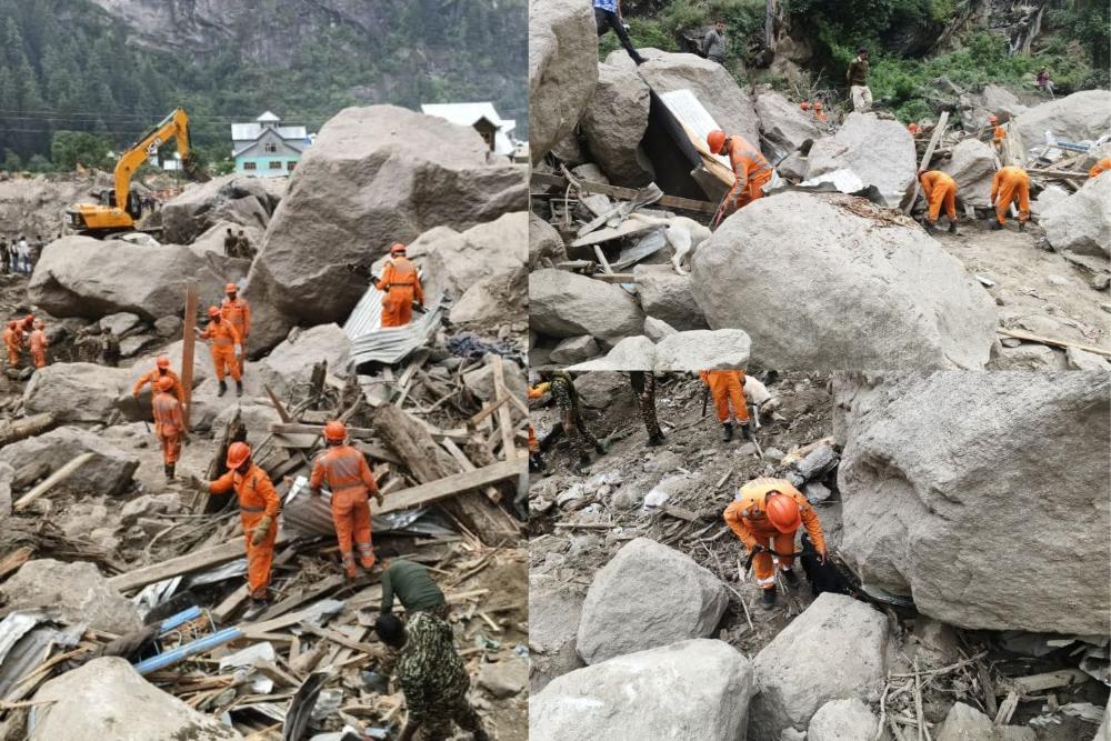 Rescue workers from India’s NDRF in orange uniforms searching through boulders and debris after the Chasoti cloudburst in Kishtwar, Jammu & Kashmir, August 2025.