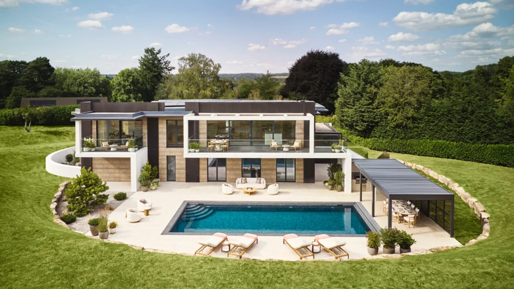 Primary bedroom with direct access to private walled courtyard featuring outdoor seating and minimalist landscaping.