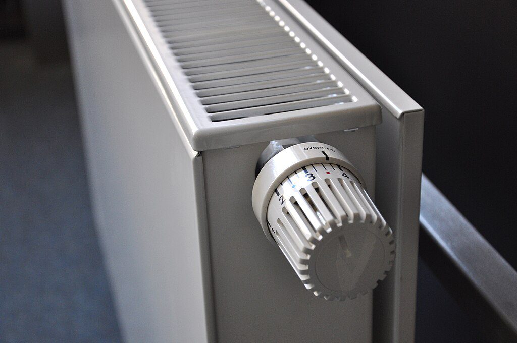 A home radiator providing warmth during winter, symbolizing heating support for pensioners.