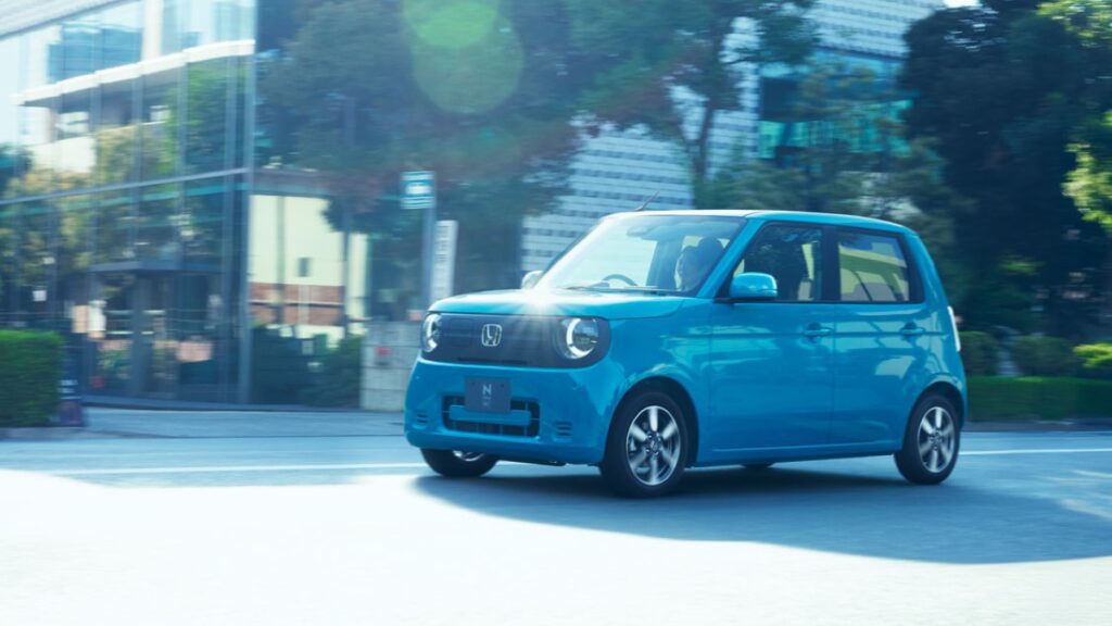 White Honda N-ONE e electric kei car on a dynamic driving course.