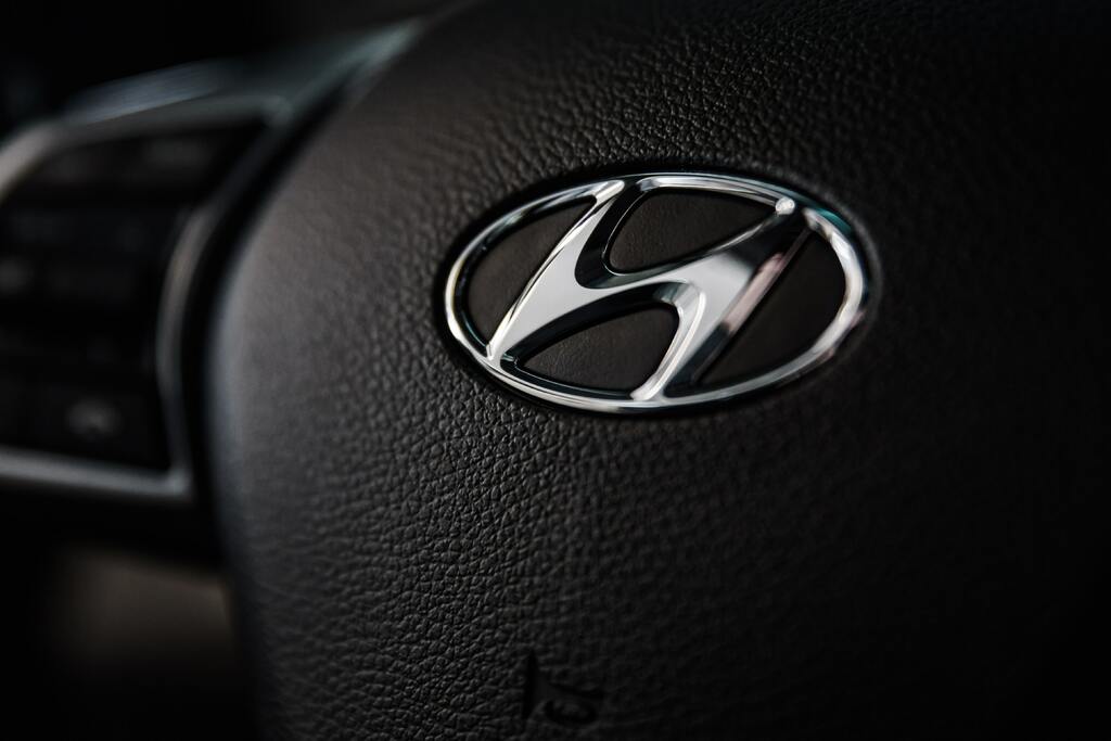Hyundai car logo on silver vehicle exterior, representing vehicles affected by the safety recall