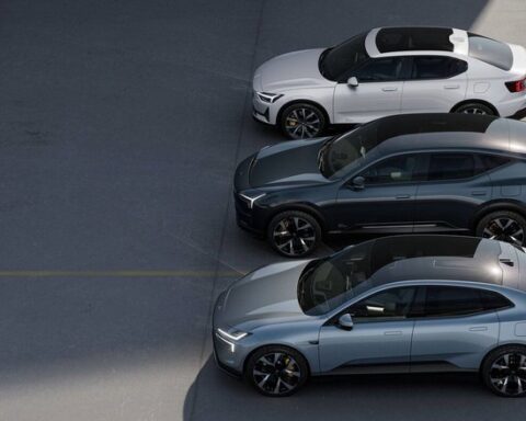 Three Polestar electric vehicles parked in a row, including the Polestar 2 sedan and Polestar 3 SUV, showcasing the company's premium EV lineup.