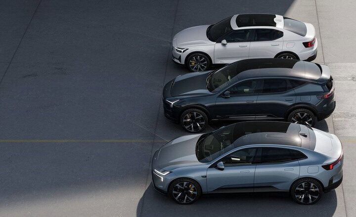 Three Polestar electric vehicles parked in a row, including the Polestar 2 sedan and Polestar 3 SUV, showcasing the company's premium EV lineup.
