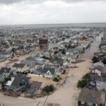 Aerial view of extensive flooding in a New Jersey coastal community showing damaged homes and flooded streets following Hurricane Sandy.