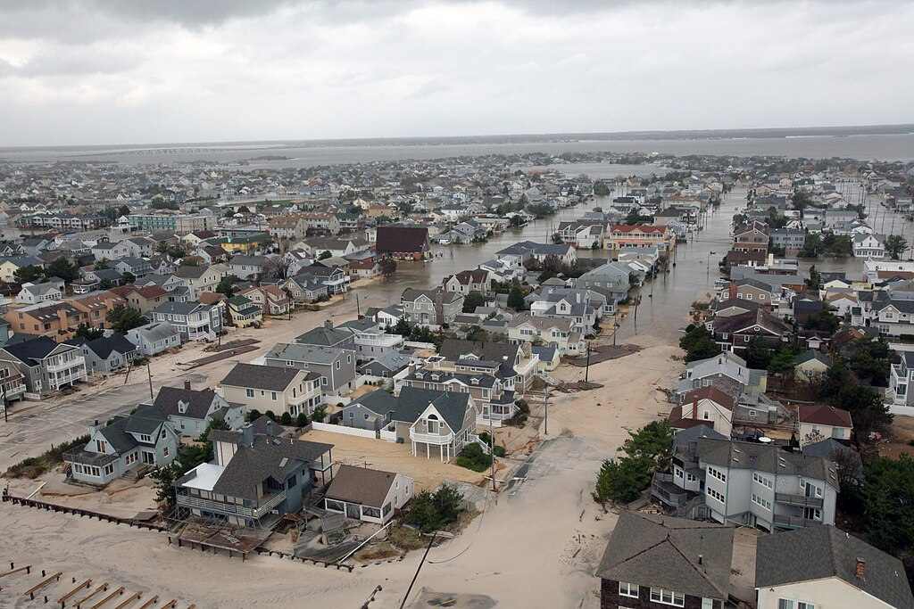 Aerial view of extensive flooding in a New Jersey coastal community showing damaged homes and flooded streets following Hurricane Sandy.