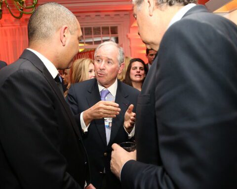 A business leader speaking with attendees at the World Economic Forum in Davos, photographed during the FT CNBC Nightcap 2016.