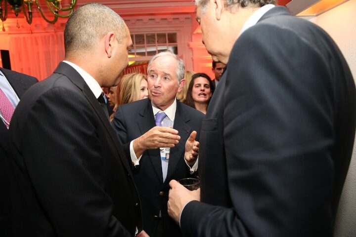 A business leader speaking with attendees at the World Economic Forum in Davos, photographed during the FT CNBC Nightcap 2016.