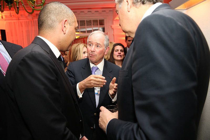 A business leader speaking with attendees at the World Economic Forum in Davos, photographed during the FT CNBC Nightcap 2016.