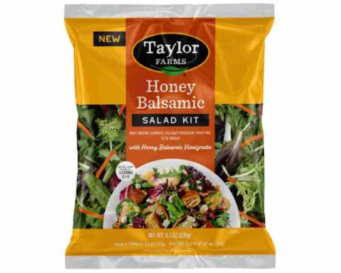 Taylor Farms Honey Balsamic Salad Kit in yellow and orange packaging showing baby greens, carrots, and feta cheese with honey balsamic vinaigrette dressing that has been recalled due to undeclared allergens.