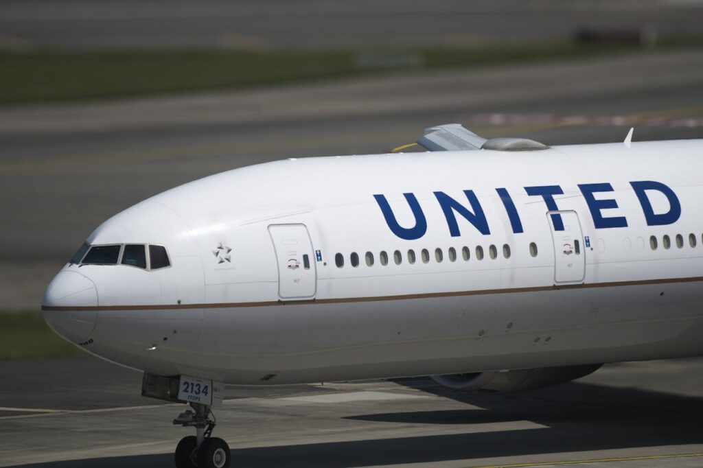 United Airlines commercial aircraft on airport taxiway showing airline livery and branding