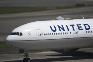 United Airlines commercial aircraft on airport taxiway showing airline livery and branding