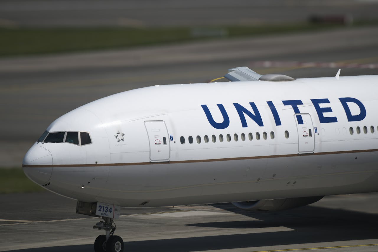 United Airlines commercial aircraft on airport taxiway showing airline livery and branding