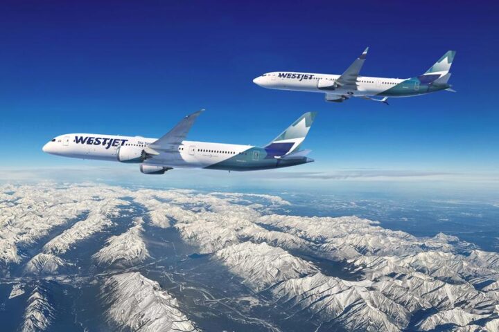 Two WestJet aircraft - a Boeing 737 in the foreground and a Boeing 787 Dreamliner in the background - flying over snow-capped mountains of the Canadian Rockies against a clear blue sky.