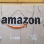 Amazon logo signage on an interior wall at the company’s Sydney office, photographed in April 2023 by Shkuru Afshar.