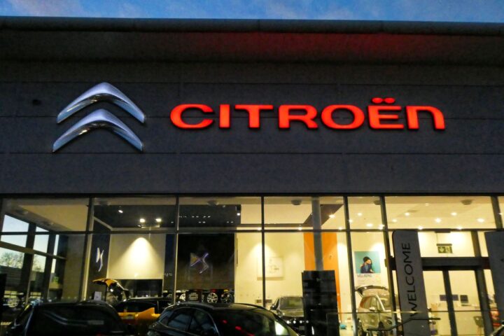Citroën dealership storefront at night in Chingford, London with illuminated Citroën logo and branding.