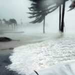 Hurricane season graphic with storm icon and coastal waves used by RGS for education resources.