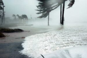 Hurricane season graphic with storm icon and coastal waves used by RGS for education resources.
