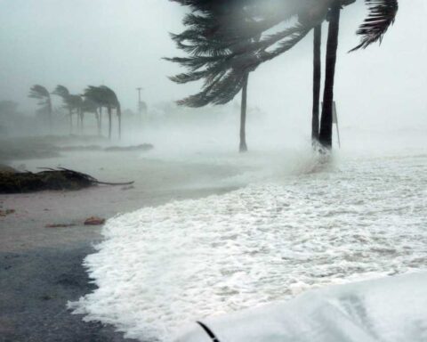 Hurricane season graphic with storm icon and coastal waves used by RGS for education resources.