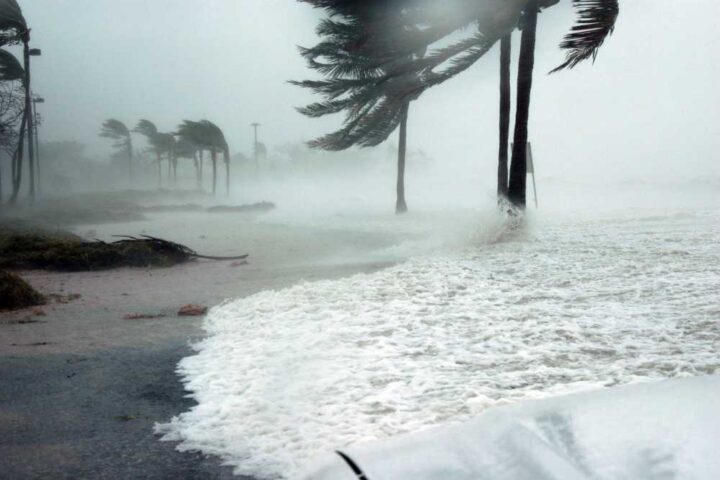 Hurricane season graphic with storm icon and coastal waves used by RGS for education resources.