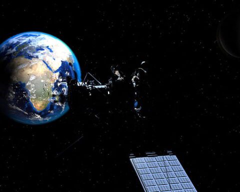 Illustration of Earth with the Moon and a satellite against a dark space background