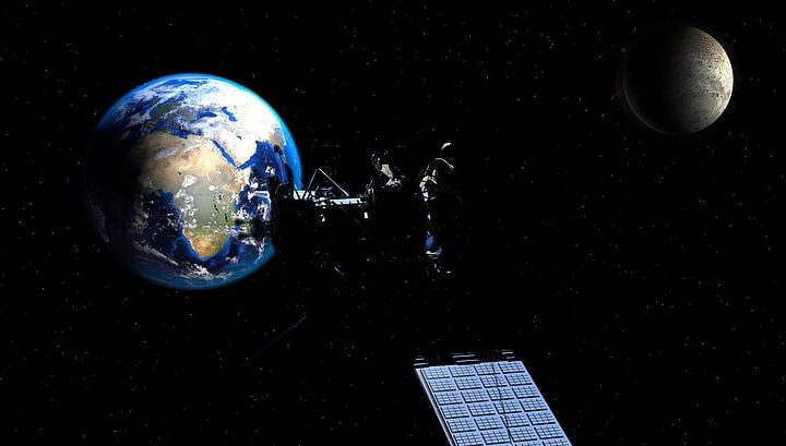 Illustration of Earth with the Moon and a satellite against a dark space background