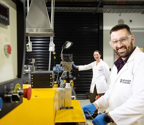 Edward Attenborough and Dr Leonie van 't Hag working in a laboratory at Monash University with scientific equipment used for creating bioplastics from food waste sugars.