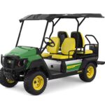 John Deere GX Crew Electric Utility Vehicle with green body, yellow seats and wheels, featuring a four-passenger configuration with protective canopy and rugged all-terrain tires