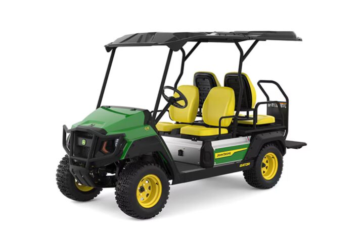 John Deere GX Crew Electric Utility Vehicle with green body, yellow seats and wheels, featuring a four-passenger configuration with protective canopy and rugged all-terrain tires