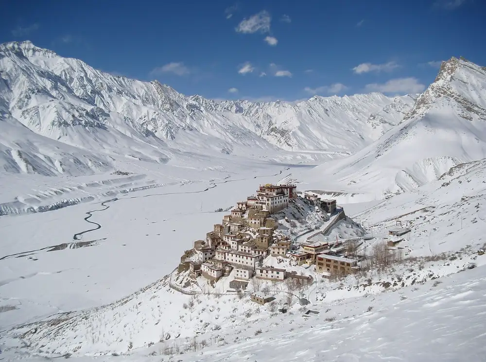 Key Monastery on a hill above the Spiti Valley with the Spiti river and Himalayan ridges visible, illustrating cultural heritage within the Cold Desert Biosphere Reserve.