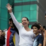 María Corina Machado addressing supporters at a 2019 Caracas march, symbolizing Venezuela’s democratic struggle.