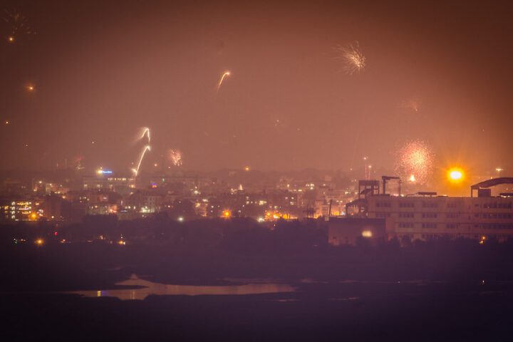 Aerial view of Diwali fireworks illuminating Delhi's skyline with smoke and light trails
