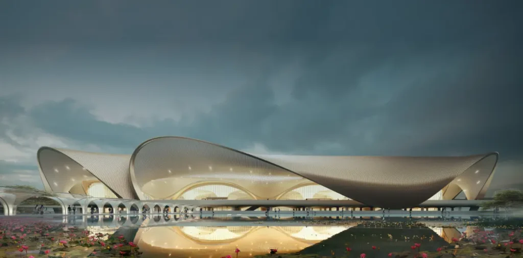 Banner image showing Navi Mumbai International Airport terminal design with modern architectural structure and landscape, released by Adani Airports.