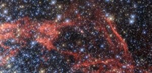 A dense field of stars and gas clouds in a galaxy. (Public Domain)