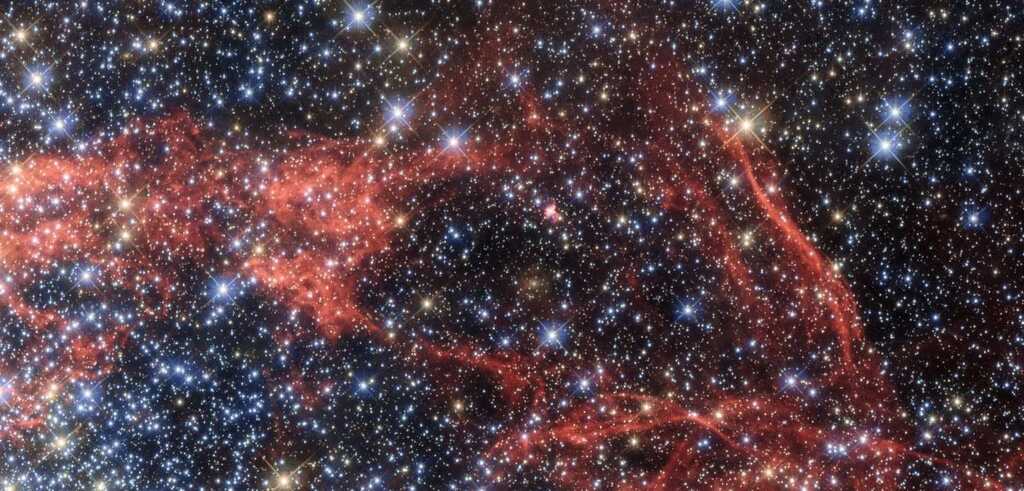 A dense field of stars and gas clouds in a galaxy. (Public Domain)