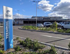 Shellharbour Airport terminal and runway area in New South Wales under clear daylight, representing regional aviation infrastructure.