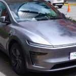 Front three-quarter view of a 2025 Tesla Model Y in Quicksilver at Tesla’s Flagship Store, Uptown BGC.