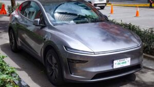 Front three-quarter view of a 2025 Tesla Model Y in Quicksilver at Tesla’s Flagship Store, Uptown BGC.